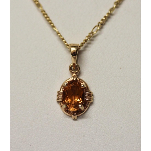 426 - Citrine oval pendant in 14ct yellow gold mount on an 18ct gold fine neck chain, gross weight 3.5gms