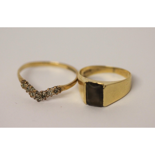 455 - 14k gold smoky quartz signet ring, size I and a 9ct wishbone ring. Gross weight of lot 3.9g