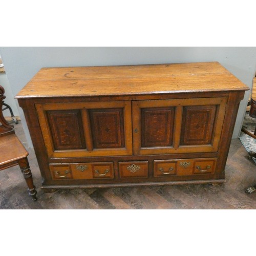 28 - Victorian oak mule chest cabinet, with fielded inlaid doors above three drawers.