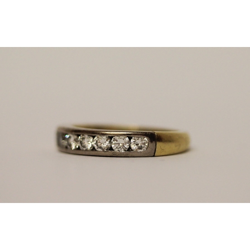 388 - A diamond half hoop eternity ring, channel set with seven brilliant cut diamonds, in 18ct yellow gol... 