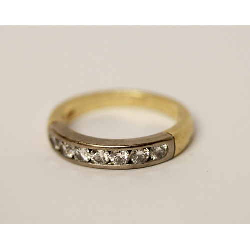 388 - A diamond half hoop eternity ring, channel set with seven brilliant cut diamonds, in 18ct yellow gol... 