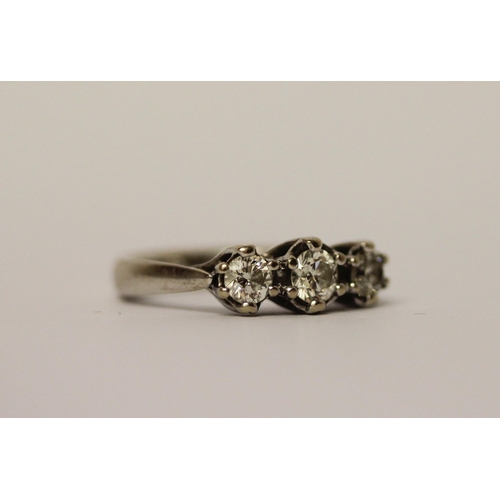 389 - A three stone diamond ring on 18ct white gold band, diamond weight marked in shank 0.75 carats, hall... 