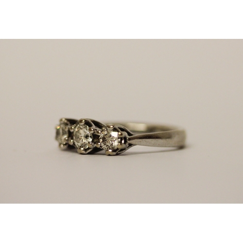 389 - A three stone diamond ring on 18ct white gold band, diamond weight marked in shank 0.75 carats, hall... 