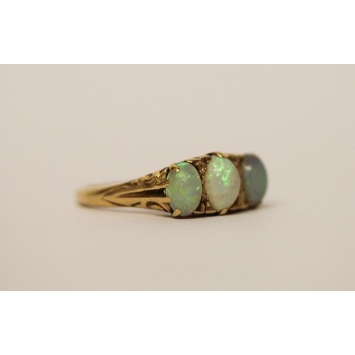 391 - 19th century three stone opal ring, on 18ct gold band, marked 18ct, ring size N, weight 4.5g