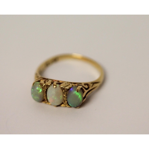 391 - 19th century three stone opal ring, on 18ct gold band, marked 18ct, ring size N, weight 4.5g