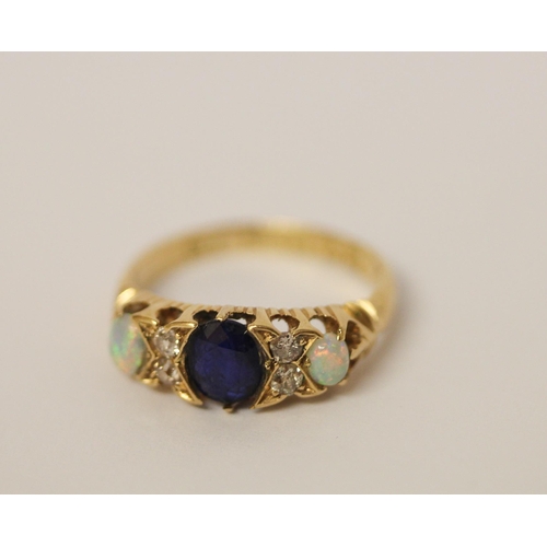 392 - An antique opal, diamond and sapphire ring, on hallmarked 18ct gold band, ring size K, weight 3.4g