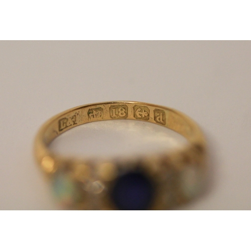 392 - An antique opal, diamond and sapphire ring, on hallmarked 18ct gold band, ring size K, weight 3.4g