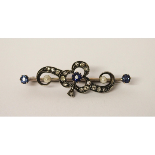 395 - An antique sapphire diamond and pearl brooch in an unmarked precious yellow and white metal setting,... 