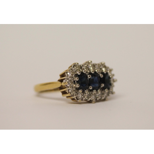 436 - A large  three stone sapphire and diamond cluster ring, on hallmarked 18ct yellow gold band, ring si... 