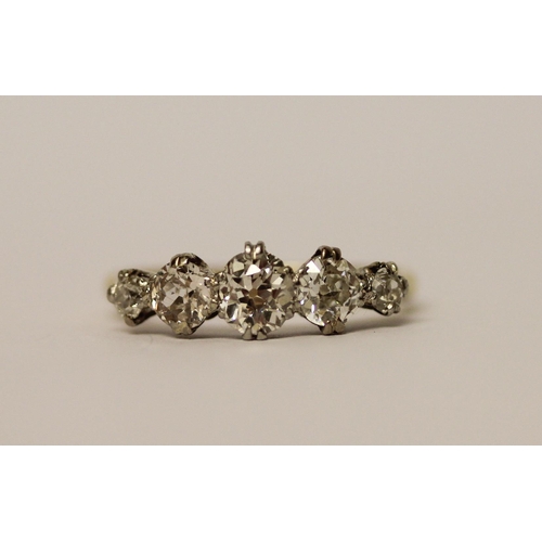 437 - A five stone diamond ring, graduated brilliant cut diamonds on a 19ct yellow gold and platinum setti... 