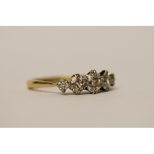 437 - A five stone diamond ring, graduated brilliant cut diamonds on a 19ct yellow gold and platinum setti... 