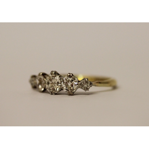 437 - A five stone diamond ring, graduated brilliant cut diamonds on a 19ct yellow gold and platinum setti... 