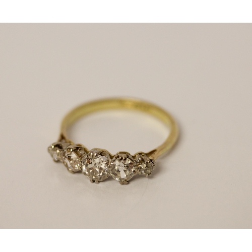 437 - A five stone diamond ring, graduated brilliant cut diamonds on a 19ct yellow gold and platinum setti... 