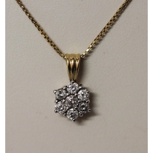 445 - A diamond daisy seven stone pendant, hallmarked 18ct gold mount on a fine 18ct yellow gold box link ... 