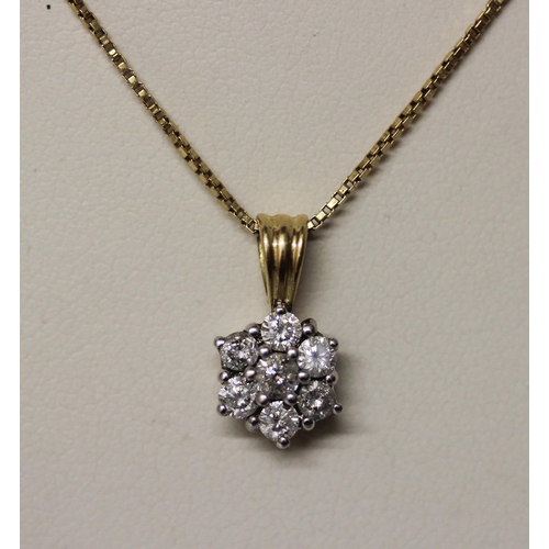 445 - A diamond daisy seven stone pendant, hallmarked 18ct gold mount on a fine 18ct yellow gold box link ... 