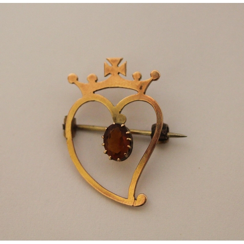 447 - Rose gold Luckenbooth brooch, the 9ct rose gold  heart set with a claw set citrine surmounted with a... 