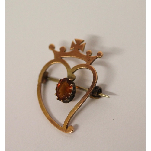 447 - Rose gold Luckenbooth brooch, the 9ct rose gold  heart set with a claw set citrine surmounted with a... 