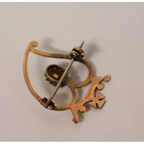 447 - Rose gold Luckenbooth brooch, the 9ct rose gold  heart set with a claw set citrine surmounted with a... 