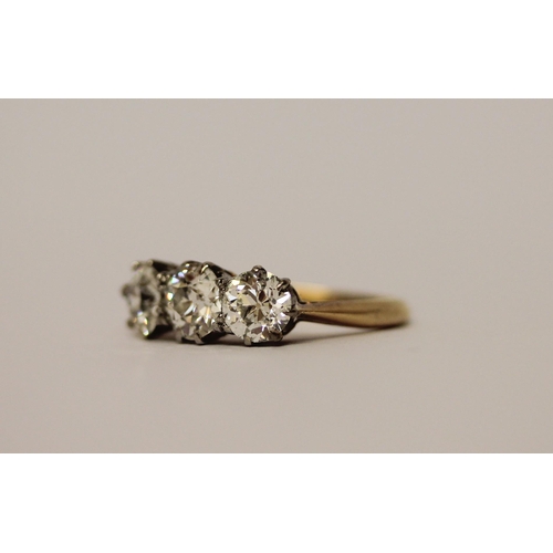 452 - A three stone diamond ring, set with old brilliant cut diamonds, with probate valuation dated 2022 s... 