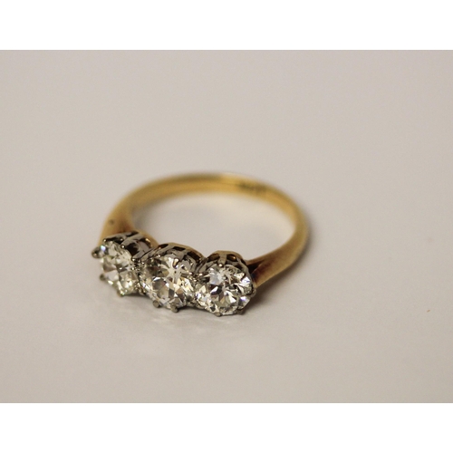 452 - A three stone diamond ring, set with old brilliant cut diamonds, with probate valuation dated 2022 s... 