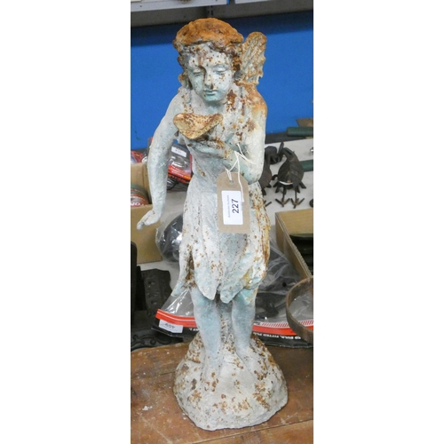 284 - A large cast iron standing fairy figure, 20