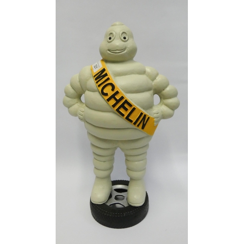 287 - A 44cm high Michelin man figurines standing on a tyre