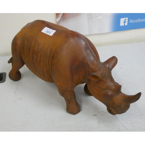 331 - A large heavy cast iron Rhinoceros garden ornament