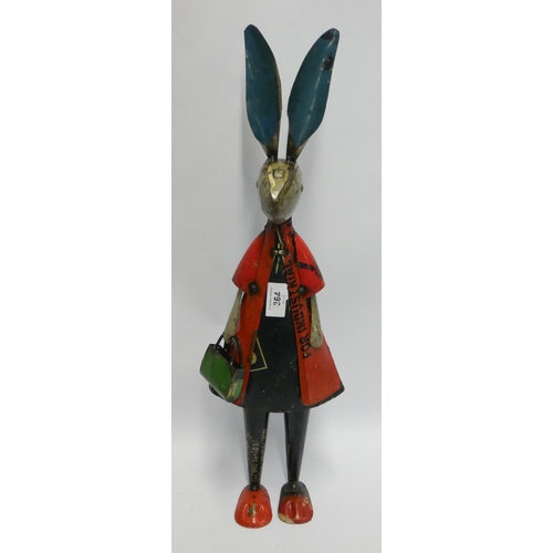 347 - A recycled tine model figure of a rabbit carrying a bag