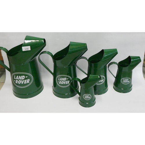 351 - A set of rive green graduated Land Rover advertising oil can jugs