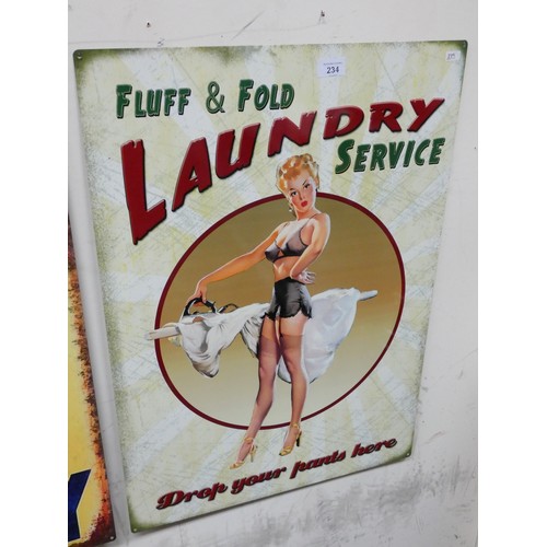 361 - A painted metal advertising sign 'Fluff & Fold Laundry Service'