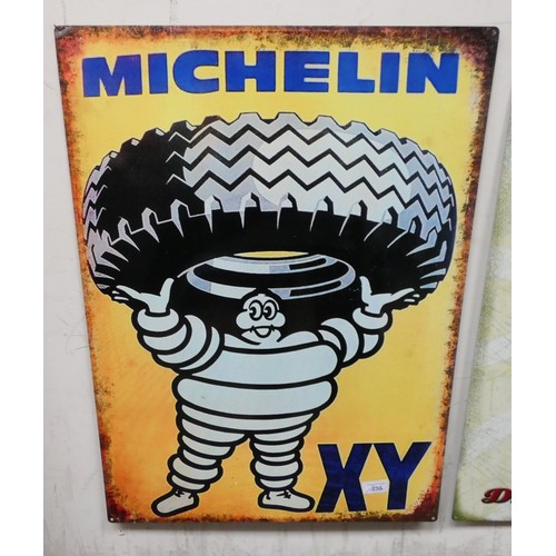 362 - A painted metal advertising sign Michelin man holding a tyre