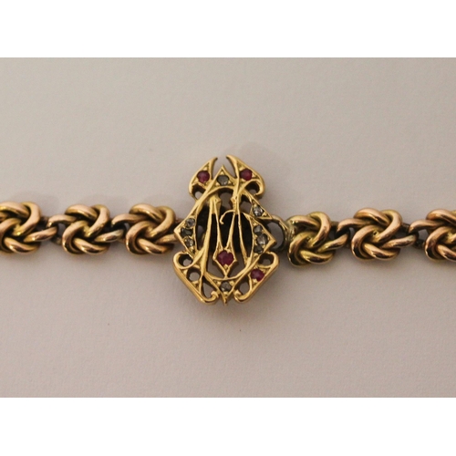 361 - Victorian 15ct gold chain link bracelet, the centre with intertwined ruby and diamond set initials C... 