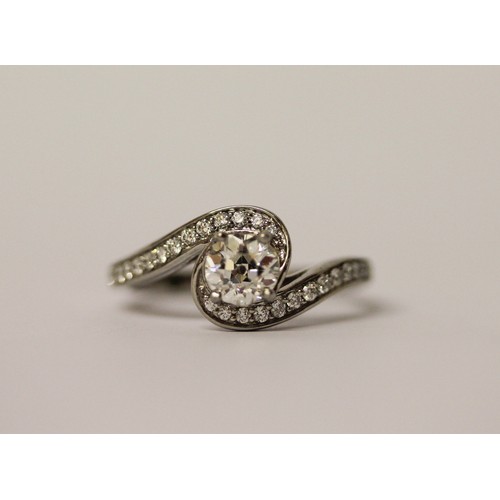 363 - A solitaire diamond ring, the circular brilliant cut diamond weighing 1.01 carats, in a modern twist... 