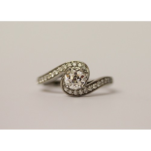 363 - A solitaire diamond ring, the circular brilliant cut diamond weighing 1.01 carats, in a modern twist... 