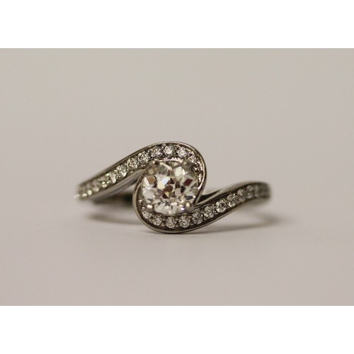 363 - A solitaire diamond ring, the circular brilliant cut diamond weighing 1.01 carats, in a modern twist... 