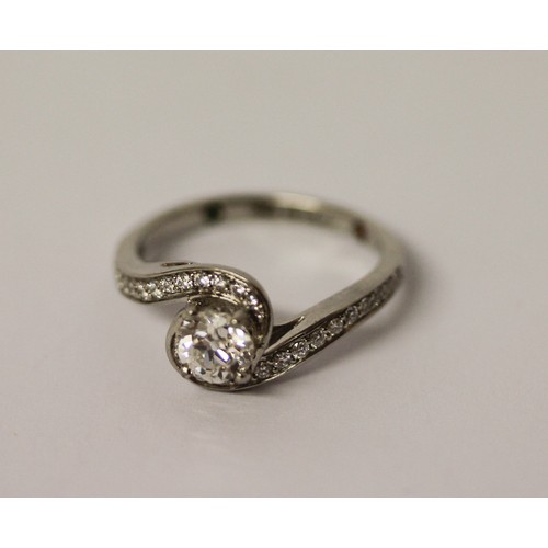 363 - A solitaire diamond ring, the circular brilliant cut diamond weighing 1.01 carats, in a modern twist... 