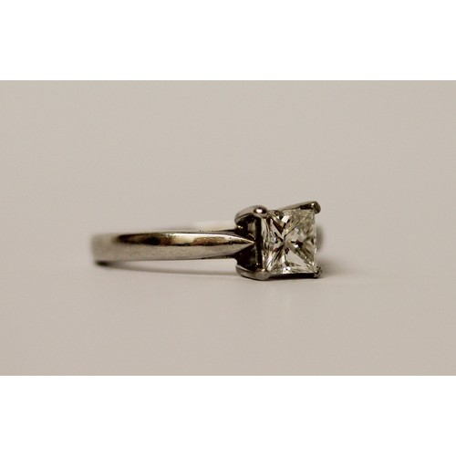 365 - A modern platinum and princess cut diamond engagement ring, the diamond weighing 0.75 carat in claw ... 