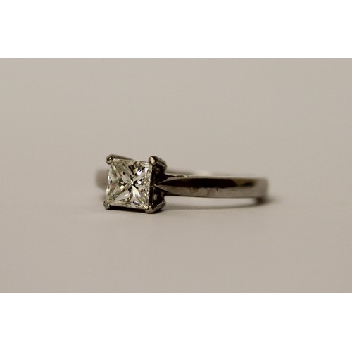 365 - A modern platinum and princess cut diamond engagement ring, the diamond weighing 0.75 carat in claw ... 