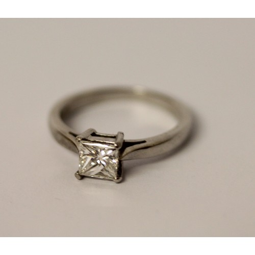 365 - A modern platinum and princess cut diamond engagement ring, the diamond weighing 0.75 carat in claw ... 