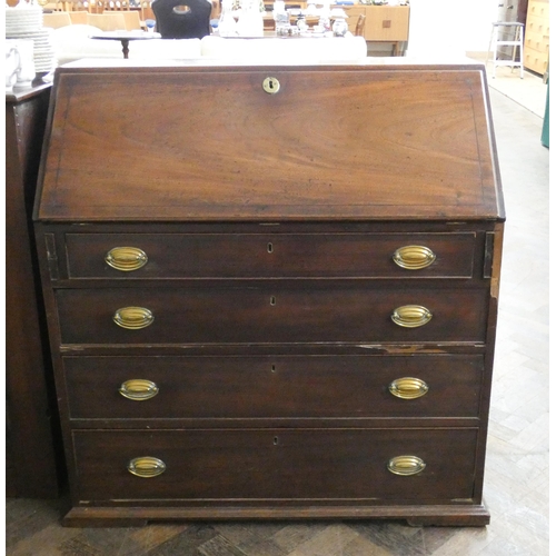 149 - A Georgian mahogany bureau with fitted interior and four long drawers under with brass handles, 38