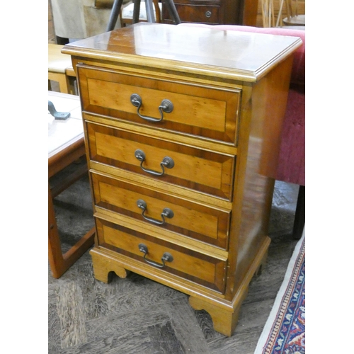 135 - A yew wood chest of four long drawers