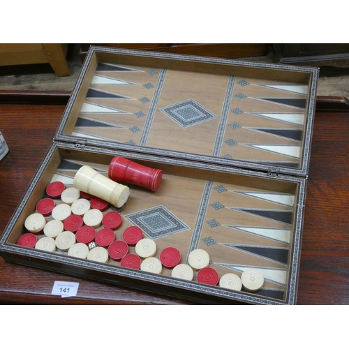 140 - A Victorian stained bone draughts set in Moroccan and bone inlaid travelling case