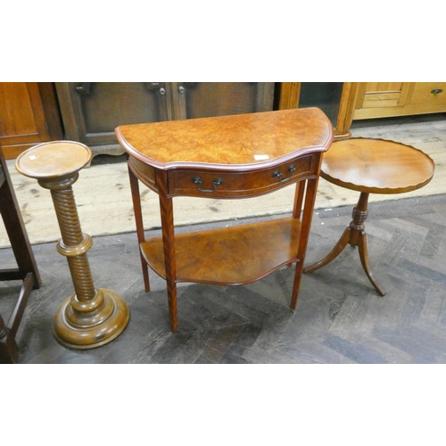 142 - A Burr yew wood two tier console table an occasional pie crust wine table and a plant stand