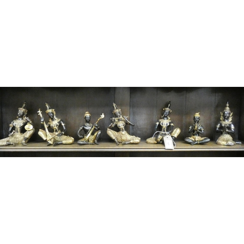 147 - A Thai bronze and gilt seven piece band figurine