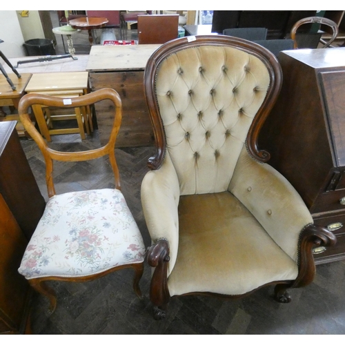 151 - A large carved Victorian style button back chair together with an occasional chair with floral uphol... 