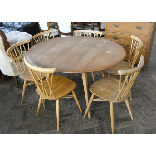 154 - A mid-century blonde elm Ercol drop leaf oval dining table