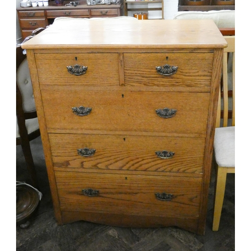 162 - An antique golden oak chest of drawers made by Henry Barker Nottingham