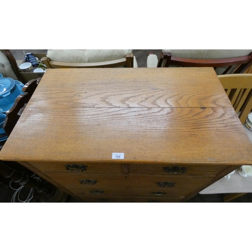 162 - An antique golden oak chest of drawers made by Henry Barker Nottingham