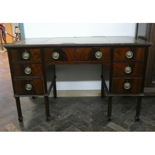 2 - An Edwardian mahogany kneehole desk fitted seven drawers with circular brass handles and inset green... 