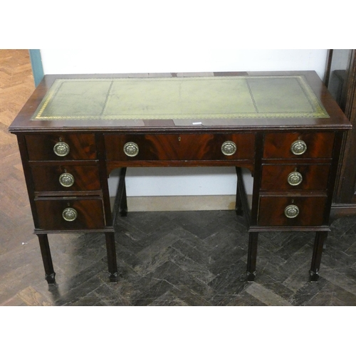 2 - An Edwardian mahogany kneehole desk fitted seven drawers with circular brass handles and inset green... 